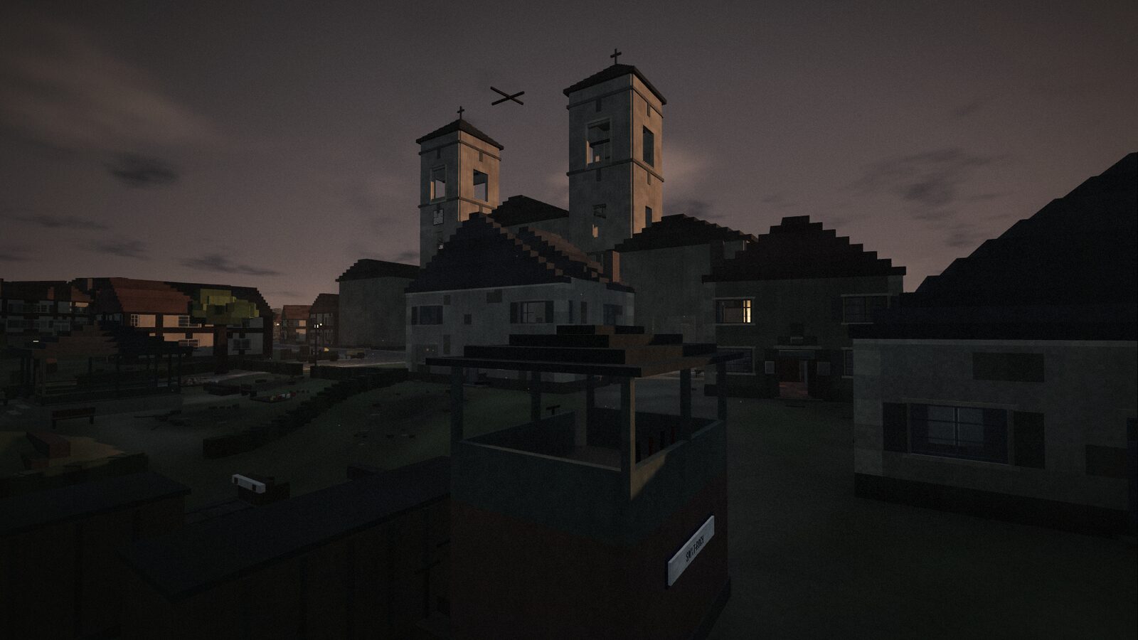 Saint-Roch Abbey at dusk, its twin bell towers above the square.